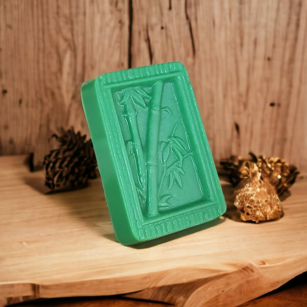 Handcrafted soap bar infused with green tea and cucumber invigorating scent, featuring a bamboo design.