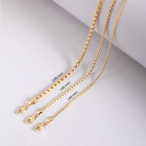 May include: Three gold-toned box chains of varying thicknesses, each featuring a lobster claw clasp. The chains are labeled with their respective widths of 2.80 mm, 1.85 mm, and 1.40 mm, clearly indicating the size difference between each individual chain.
