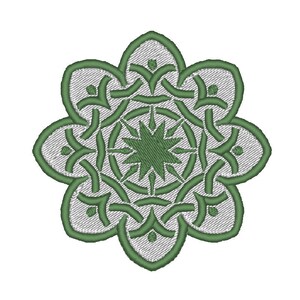 May include: A green and white mandala with a starburst design in the center. The mandala is made up of intricate patterns and shapes.