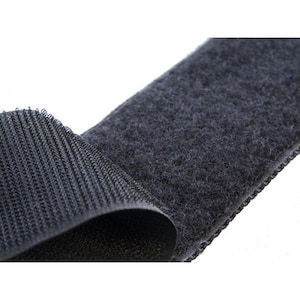 May include: Black hook and loop fastener tape. One side is a soft, fuzzy material and the other side is a woven, textured material.