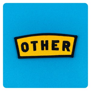 May include: Yellow fabric patch with black stitching and the word "OTHER" in black lettering.