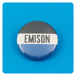 May include: A round button with a black, white, and blue design. The word "EMISON" is printed in white letters on a white stripe.