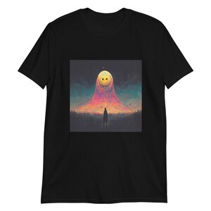May include: A black t-shirt with a graphic of a smiling moon in a colorful sky. The moon is surrounded by a pink and orange glow, and a small figure stands in the foreground.