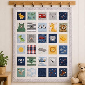 May include: A patchwork quilt with a light grey border, featuring 25 squares with animal and vehicle designs. The quilt is hanging on a white wall with a wooden rack above it. A teddy bear sits on a small wooden stool.