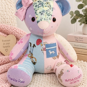 May include: A patchwork teddy bear made of various fabrics in shades of pink, purple, and blue. It features a floral forehead, a pink bow on the left ear, and a blue chest pocket with a dog graphic. The feet are embroidered with Frankie Rae, 16/04/2026, and 4080g.