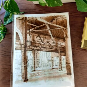 May include: A sepia-toned ink drawing of a building's interior with a large, open space and a series of steel beams and columns. The drawing is done in a realistic style and captures the architectural details of the building.