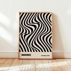 May include: Black and white abstract art print with wavy lines. The print has the text "Bauhaus Ausstellung 1923" at the bottom.