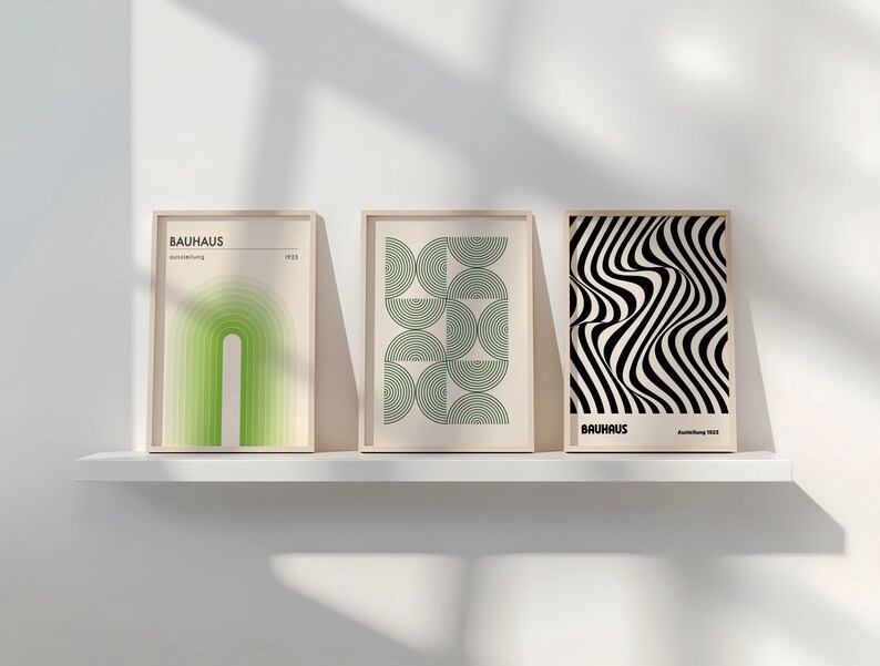 May include: Three framed prints with geometric designs in black, white, and green. The prints are titled "Bauhaus" and feature abstract shapes and patterns.
