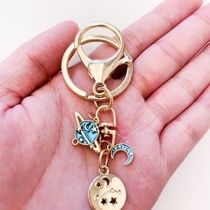 Blue Moon UV Resin Zodiac Gold Plated Keychain Charm with Blue Planet