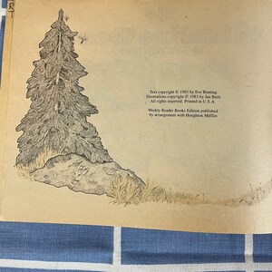 May include: A black and white illustration of a pine tree with a rock at its base. The illustration is on a light brown background with text at the bottom of the page. The text reads: "Text copyright &copy; 1983 by Eve Bunting. Illustrations copyright &copy; 1983 by Jan Brett. All rights reserved. Printed in U.S.A. Weekly Reader Books Edition published by arrangement with Houghton Mifflin."