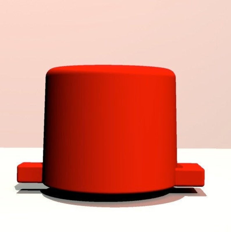 Peut inclure: Un objet rond et cylindrique de couleur rouge vif avec un dessus et un dessous plats. L'objet a deux petites languettes rectangulaires de chaque c&ocirc;t&eacute;.