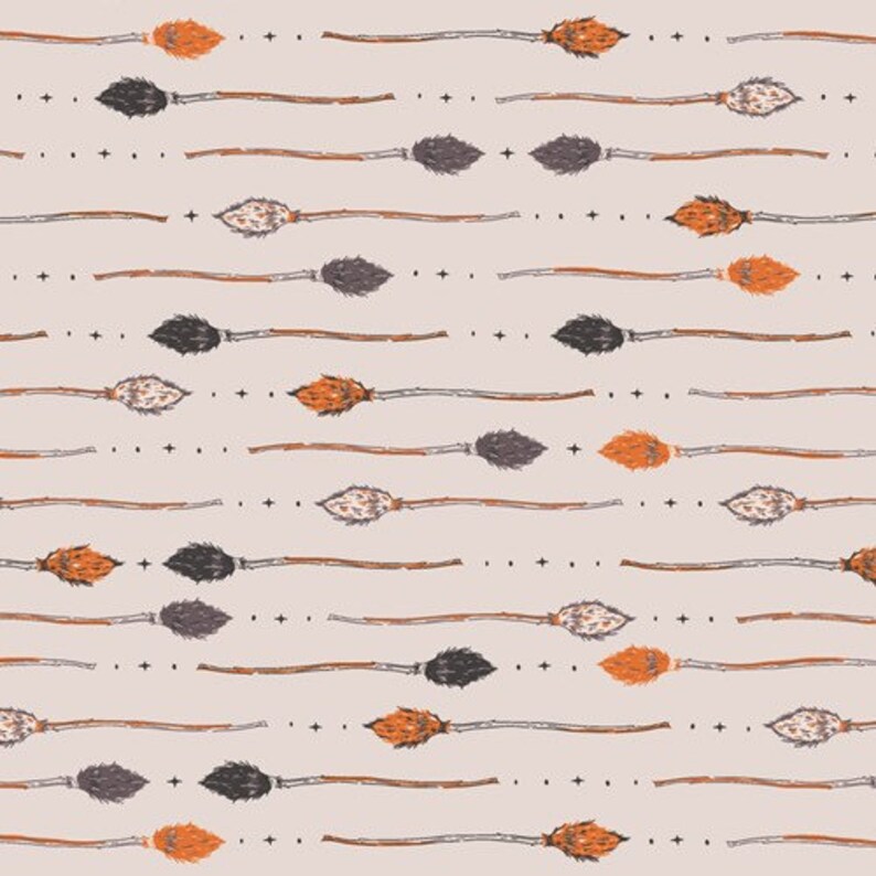 May include: A seamless pattern featuring a repeating design of orange, black, and gray broomsticks on a light beige background.