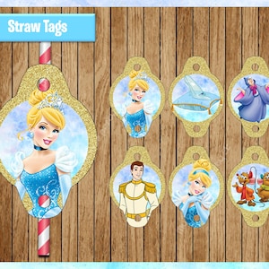 May include: Set of Cinderella-themed straw tags. Each tag features a different character or element from the classic fairy tale, including Cinderella, the glass slipper, and the Prince. The tags have a gold glitter border and are set against a wooden background.