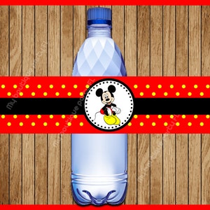 May include: Red and yellow polka dot water bottle label with a black stripe and a circle featuring Mickey Mouse in the center.