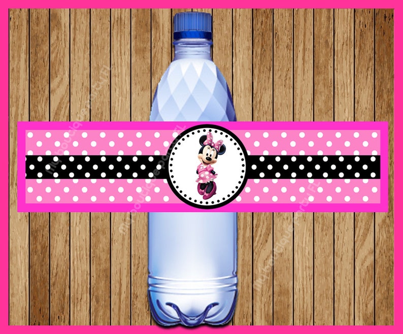 May include: Pink and black polka dot water bottle label with a Minnie Mouse character in a pink dress and white polka dots. The label has a black stripe with white polka dots.