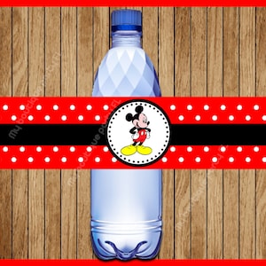 May include: Red and white polka dot water bottle label with a black stripe and a circle featuring Mickey Mouse in the center.