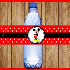 May include: Red and white polka dot water bottle label with a black stripe and a circle featuring Mickey Mouse in the center.