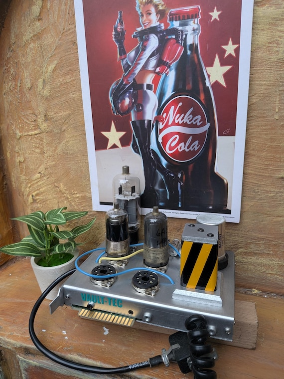 A handcrafted Fallout Water Chip replica that doubles as a steampunk lamp — the kind of desk piece that makes every visitor stop mid-sentence.