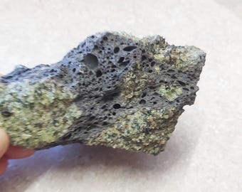 Arizona Peridot on Basalt matrix lava rock. 330grams