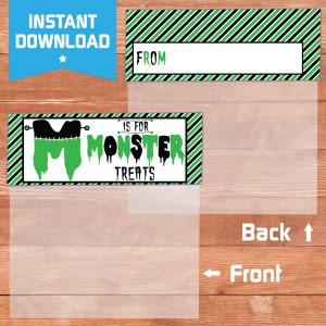 May include: Printable Halloween treat bag topper with a green monster "M" and the text "Is for Monster Treats". The topper has a black and white striped background.