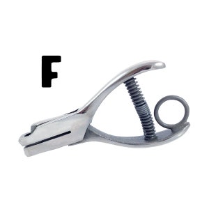 May include: A silver metal letter punch tool with a spring and a ring handle. The punch is designed to create the letter "F" in a material.