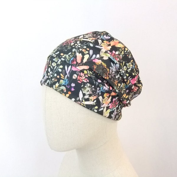 Chemo cap for a woman, watercolor flower meadow on dark grey
