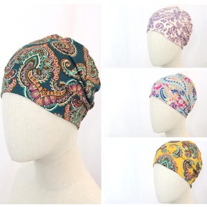May include: Four different patterned headbands in various colors, including teal, pink, blue, and yellow. Each headband features a paisley design.