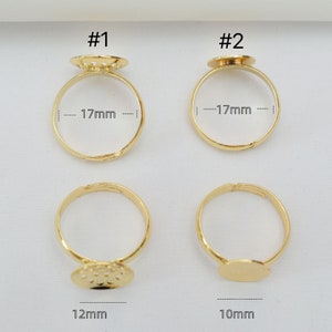 May include: Four gold-tone rings with different sized round bezels. The bezels are 17mm, 17mm, 12mm, and 10mm in diameter.