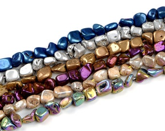 May include: A strand of iridescent gemstone beads in various colors, including blue, silver, gold, brown, purple, and iridescent. The beads are irregularly shaped and have a rough, natural texture.