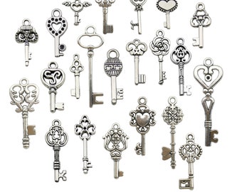 May include: A collection of antique-style silver keys with various decorative designs. The keys feature heart, floral, and ornate patterns, perfect for jewelry making or crafting projects. The keys are arranged on a white background.