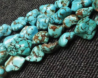 May include: A strand of turquoise gemstone beads, each bead is a unique, irregular shape with a light blue color and brown veining.