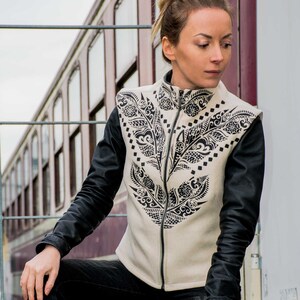 A coat without sleeves starting with cap best sale