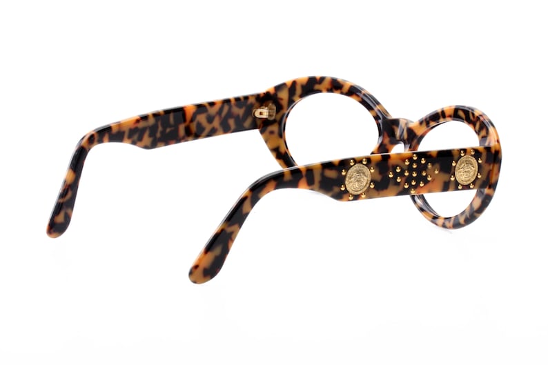 italian high fashion model from the 90s super gently used Versace sunglasses frames leopard cello enriched by golden sculptural appliques