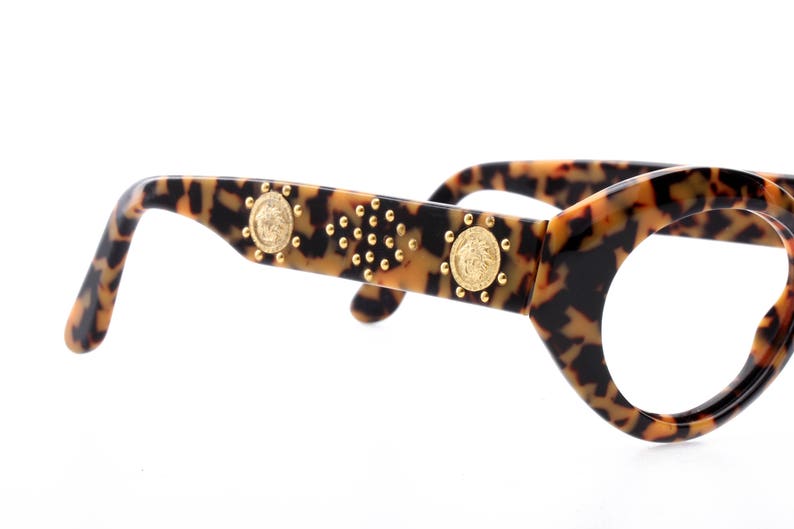 italian high fashion model from the 90s super gently used Versace sunglasses frames leopard cello enriched by golden sculptural appliques
