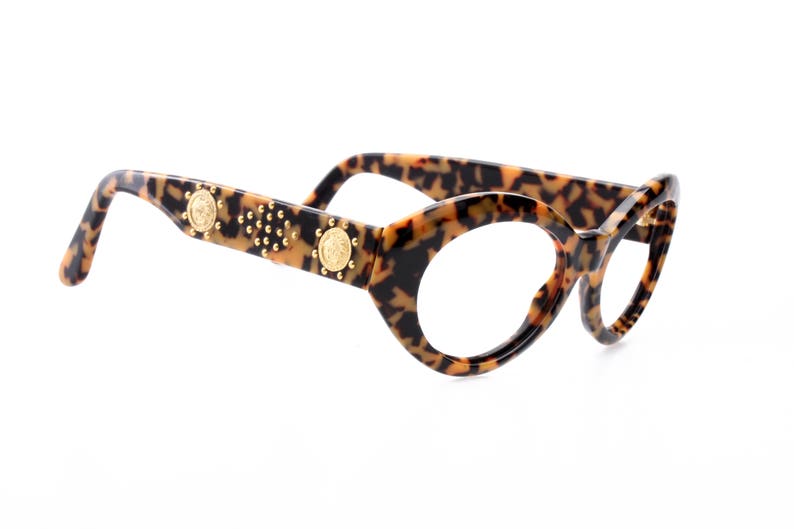 italian high fashion model from the 90s super gently used Versace sunglasses frames leopard cello enriched by golden sculptural appliques
