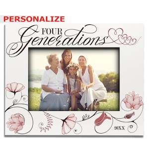 May include: White picture frame with a floral design and the text "Four Generations" in brown script. The frame has a photo of four generations of women sitting together outdoors.
