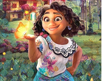 May include: A young woman with brown hair and glasses smiles as she holds out her hand to a glowing butterfly. She is wearing a white blouse with colorful embroidery and a blue skirt with a floral pattern. The background is a lush green garden with a colorful house in the distance.