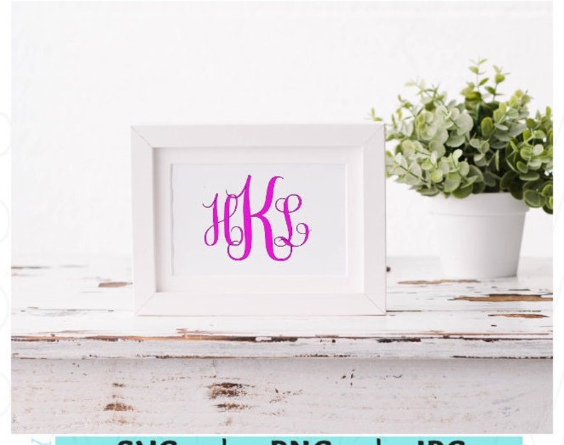 May include: A white picture frame with a white mat and a pink monogram of the letters "HKS" in a cursive font.