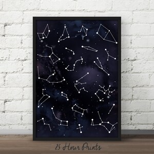 May include: A black and white print of constellations on a dark blue background. The print is framed in a black frame and has the text "25 Hour Prints" at the bottom.