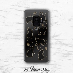 May include: A clear phone case with a black silhouette design of cats and crystals. The text "25 Hour Day" is printed on the bottom of the case.