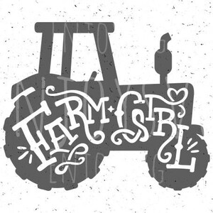 May include: A gray silhouette of a tractor with the word "Farm Girl" written in a stylized font on the side.