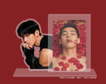 May include: A two-part image featuring a person in a black top and leather jacket, and a second person surrounded by red rose petals. The text "PHOTOCARD NOT INCLUDED" is visible at the bottom. The background is a solid red.