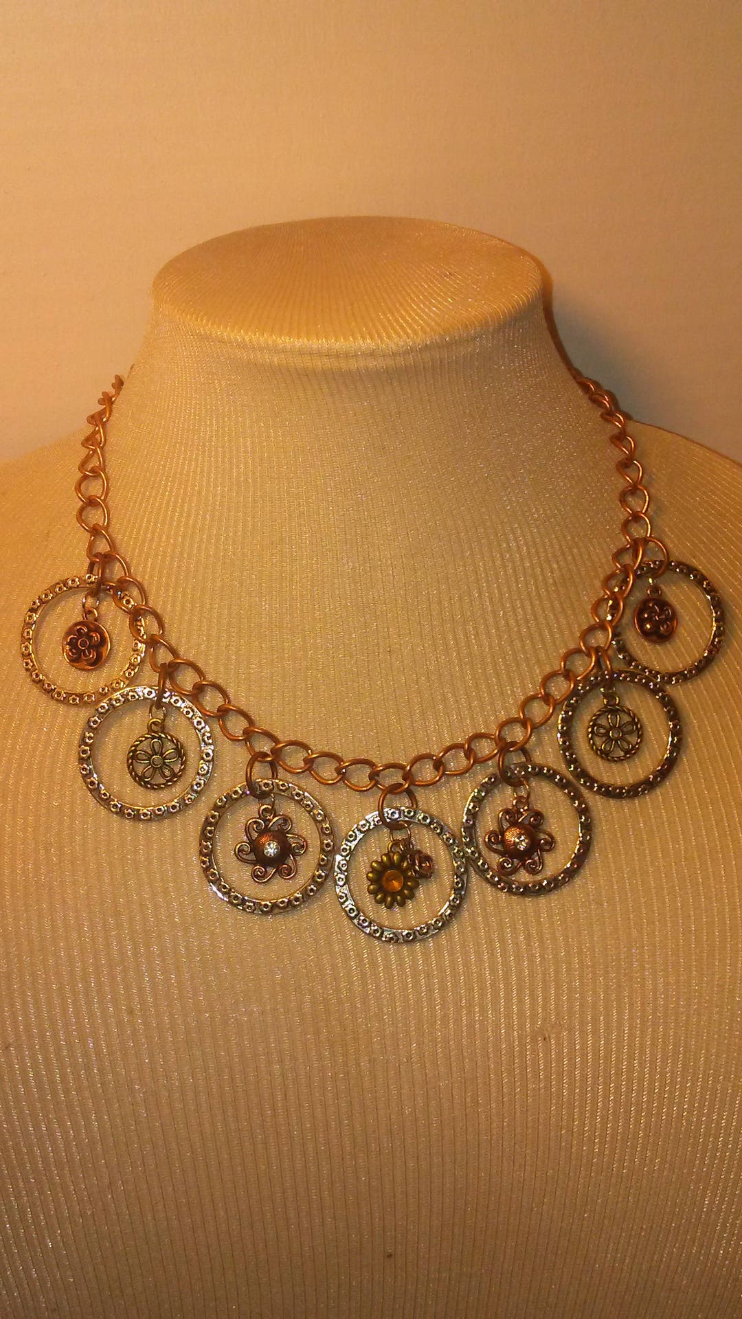 Multi Metal Necklace. Silver Circles With Small Multi Metal Flower Motif Pendants Inside. Great