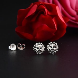 Silver earrings, ear studs, sun