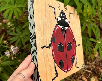 Enchanted Ladybug on Natural Wood, Leaf Border, 8x8” wood panel