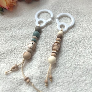 Maxicosi hanger | kinderwagen hanger | babyspeelgoed | wagenhanger