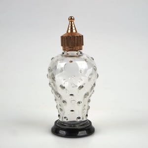 Rare 1950s Caron Poivre glass perfume scent bottle with metal stopper.