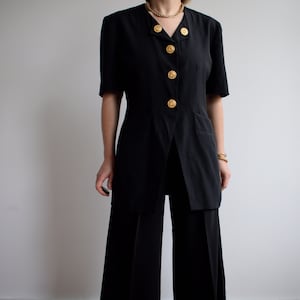 Vintage black short sleeve blazer. Originally women’s size M / L. Early 90’s era.