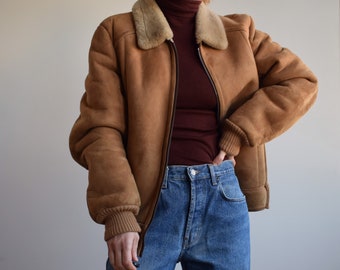 Vintage sheepskin bomber jacket. Originally women’s size M. 80’s era.