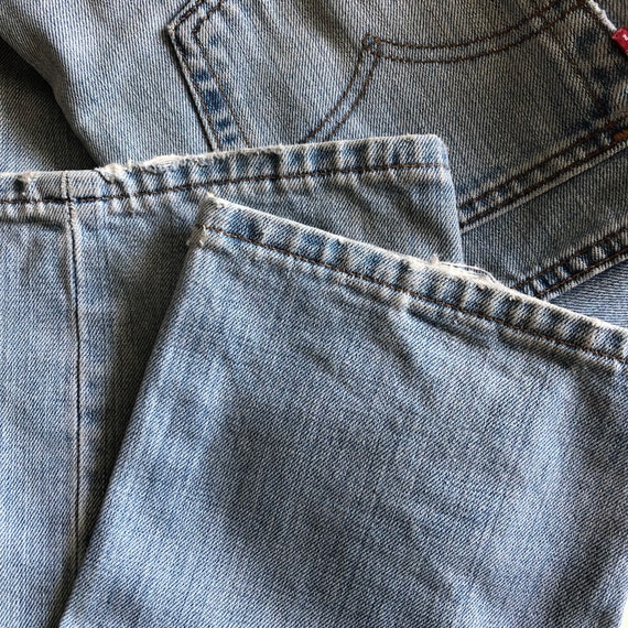 Vintage Levi’s mid rise 502 light wash jeans. Ori… - image 8